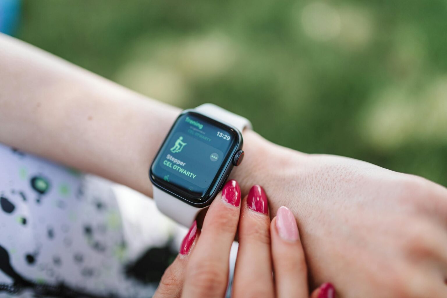 Person wearing smartwatch on wrist showing health monitoring display