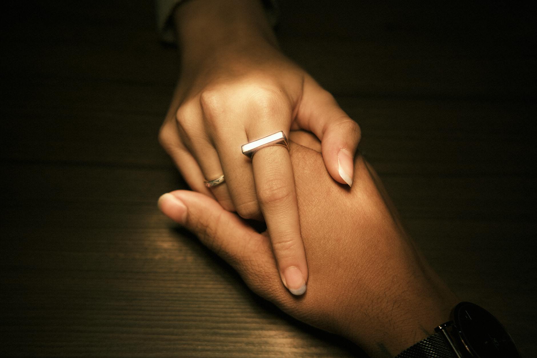Close-up of a sleek smart ring on a finger showing its minimal, comfortable design