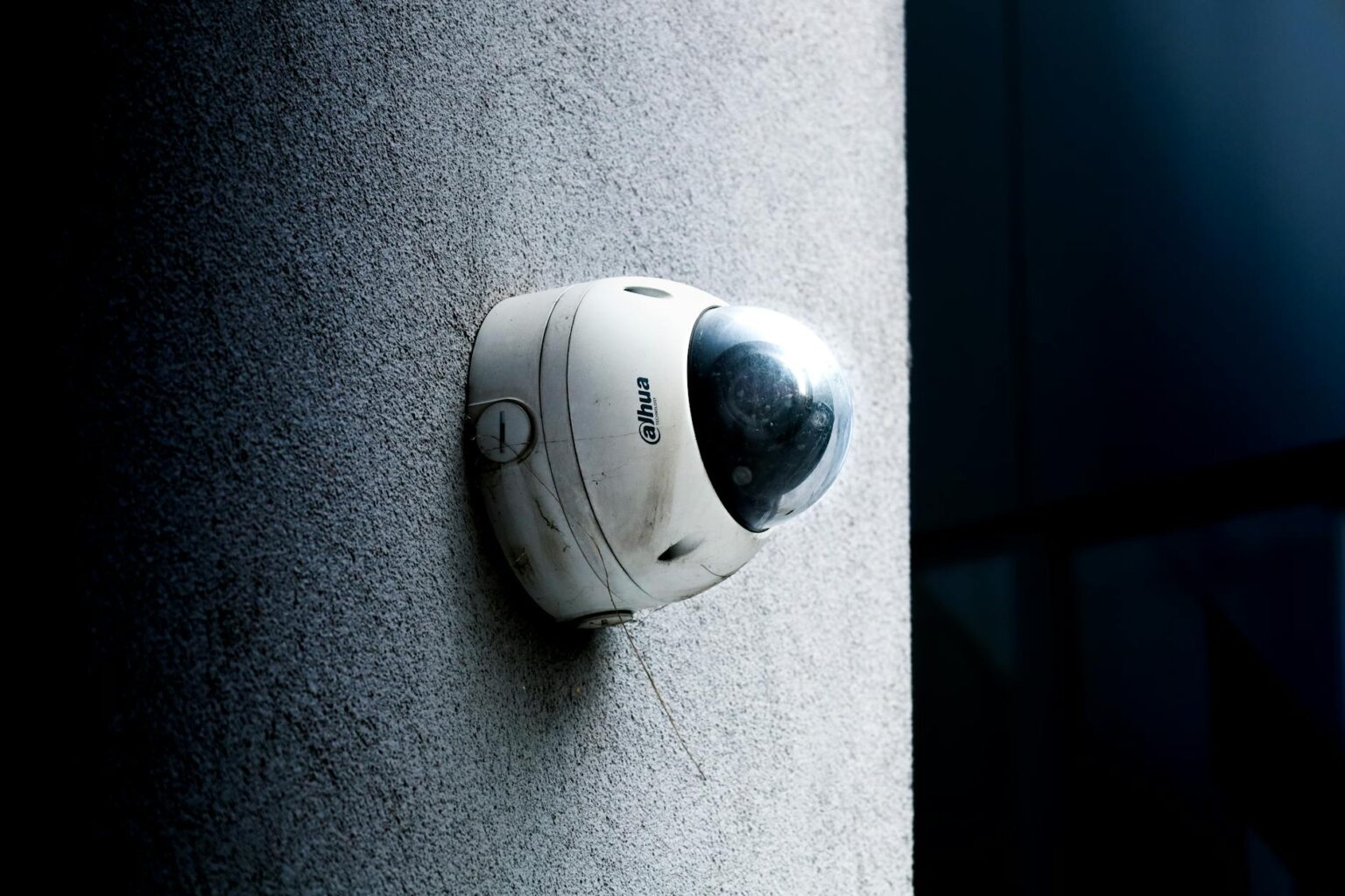 Modern smart security camera mounted near residential front door entrance