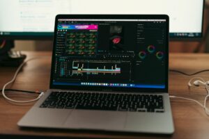 Why Video Editors Are Moving from Adobe Premiere to DaVinci Resolve Professional video editing workstation with multiple monitors displaying editing timeline and preview windows