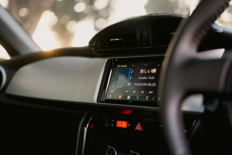Why Apple CarPlay Is Finally Getting Third-Party App Store Support Modern car dashboard with digital display showing automotive interface