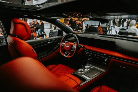 Why Digital Car Keys Are Replacing Physical Fobs in Premium Vehicles Modern luxury car interior dashboard with digital displays and wireless charging pad