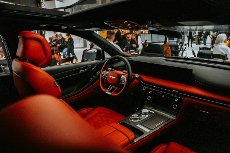 Why Digital Car Keys Are Replacing Physical Fobs in Premium Vehicles Modern luxury car interior dashboard with digital displays and wireless charging pad