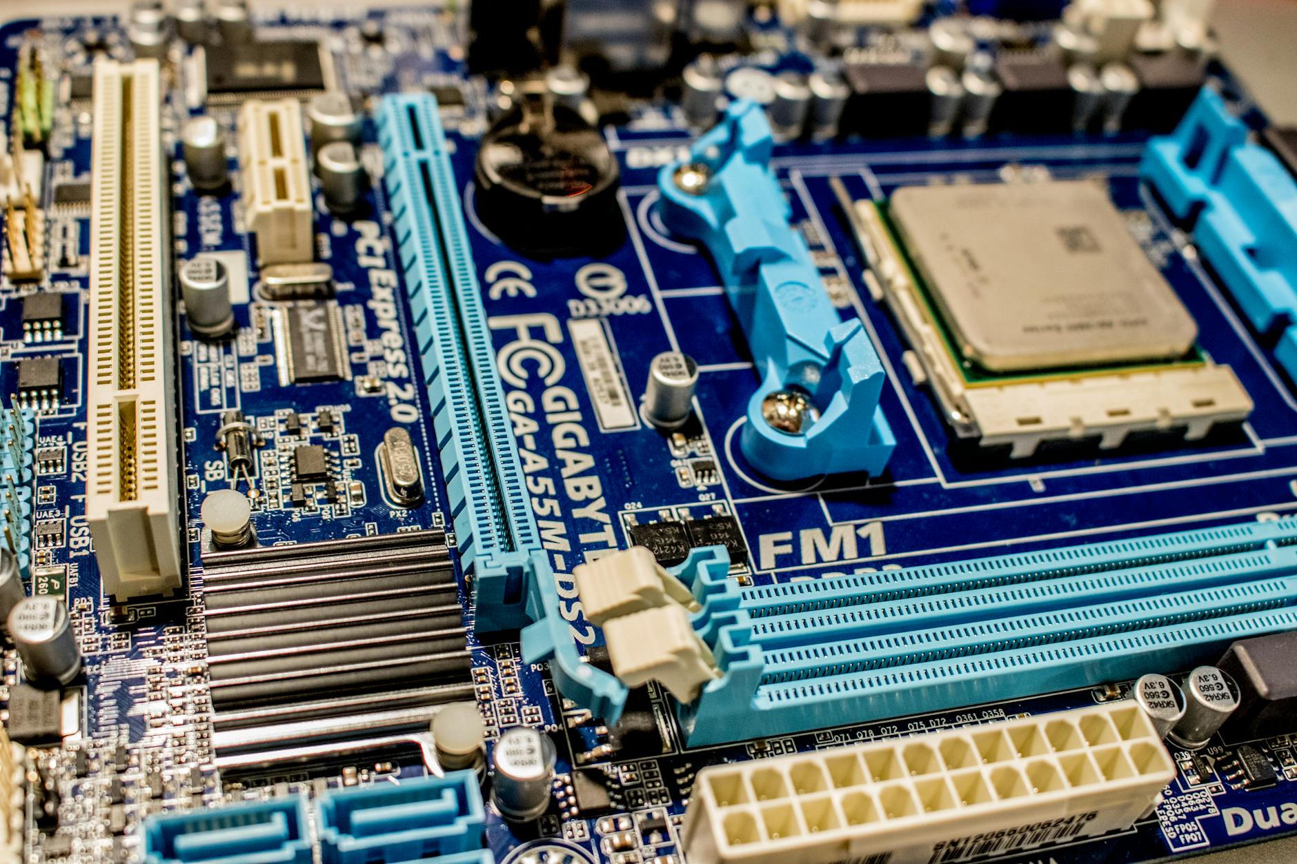 Close-up view of computer motherboard showing modular components and slots