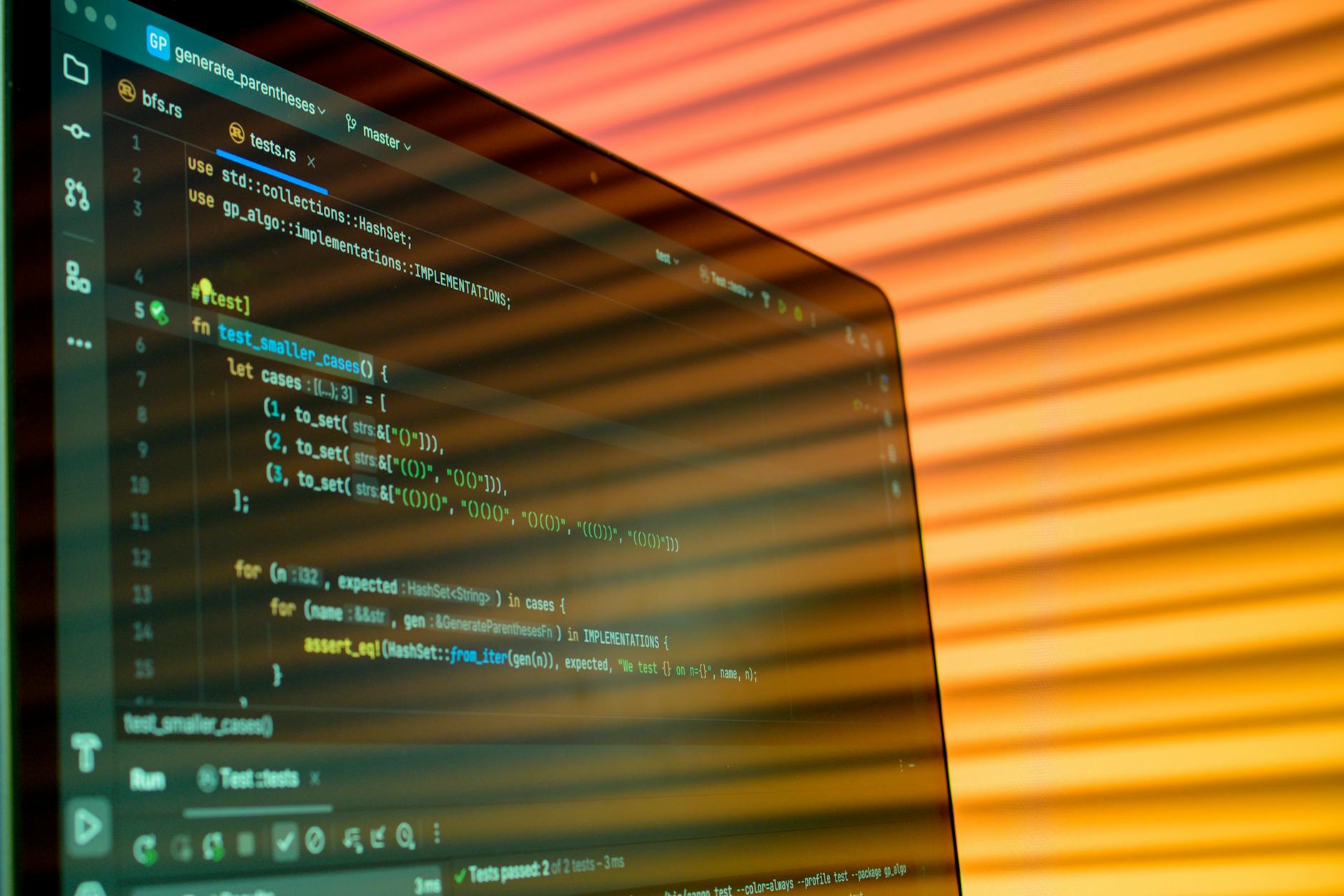 Computer monitor displaying programming code with multiple windows and development environment