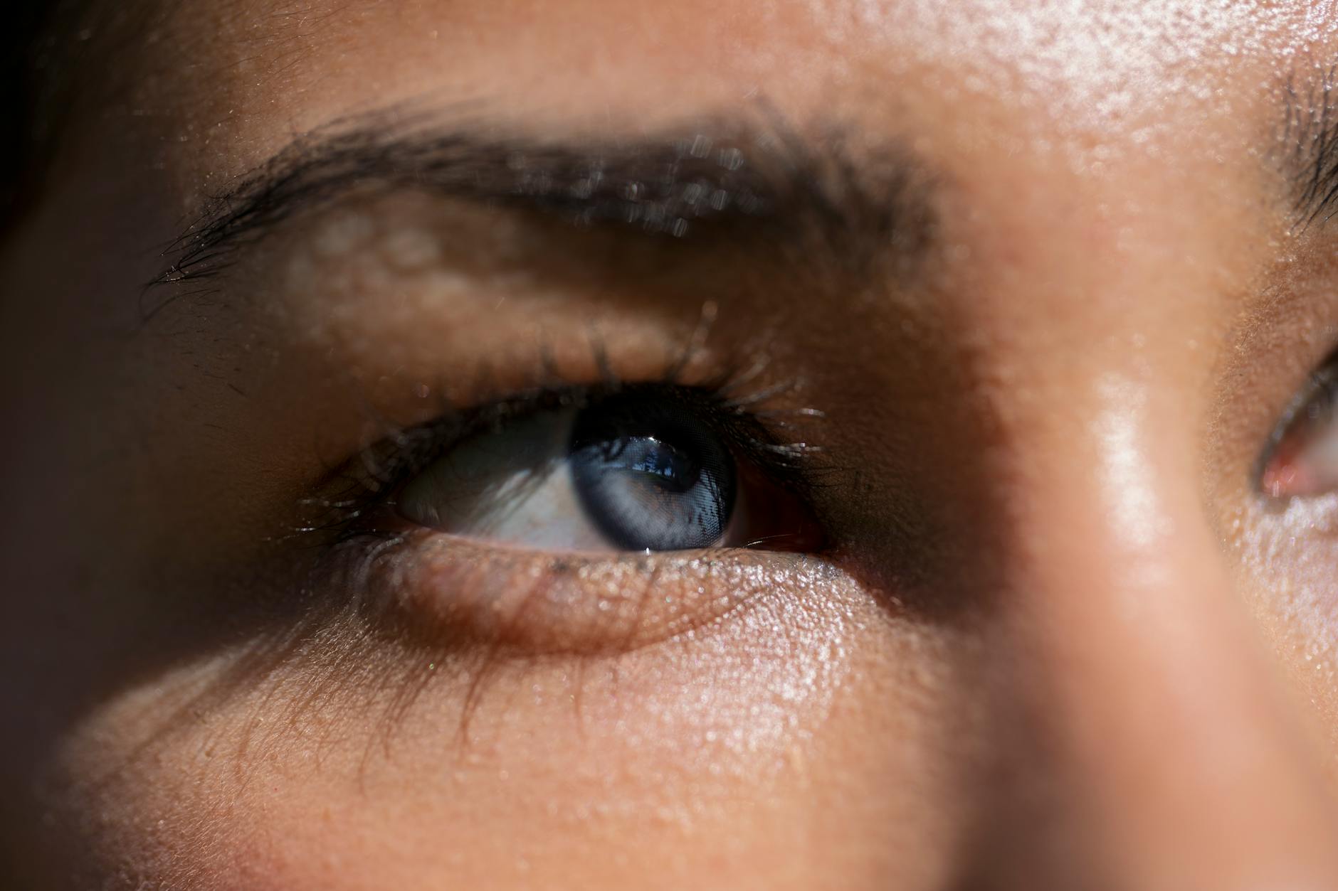 Detailed close-up of a human eye, showing where smart contact lens technology would sit to deliver AR displays directly to users' vision