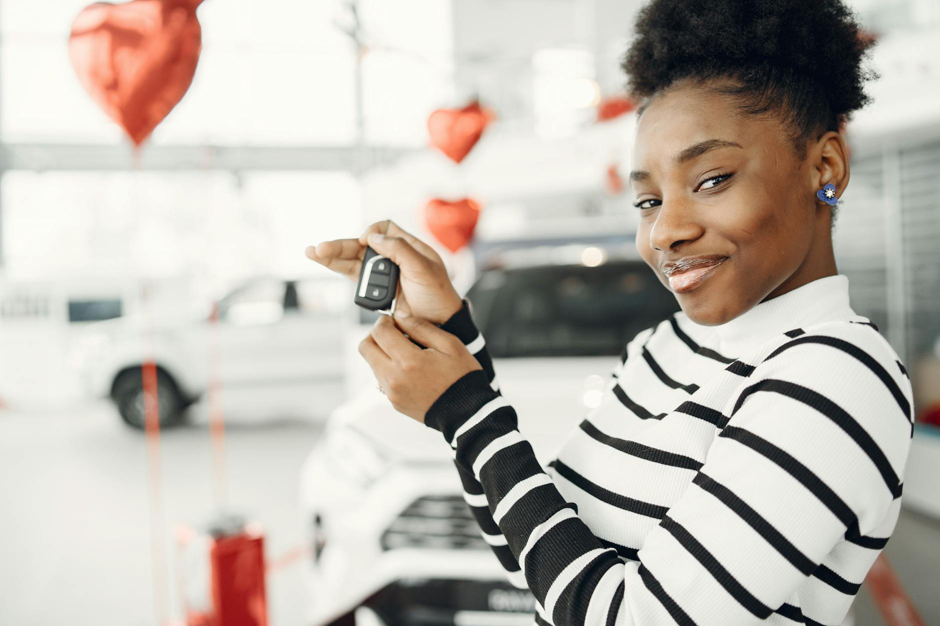 Traditional car keys next to modern smartphone representing technology transition