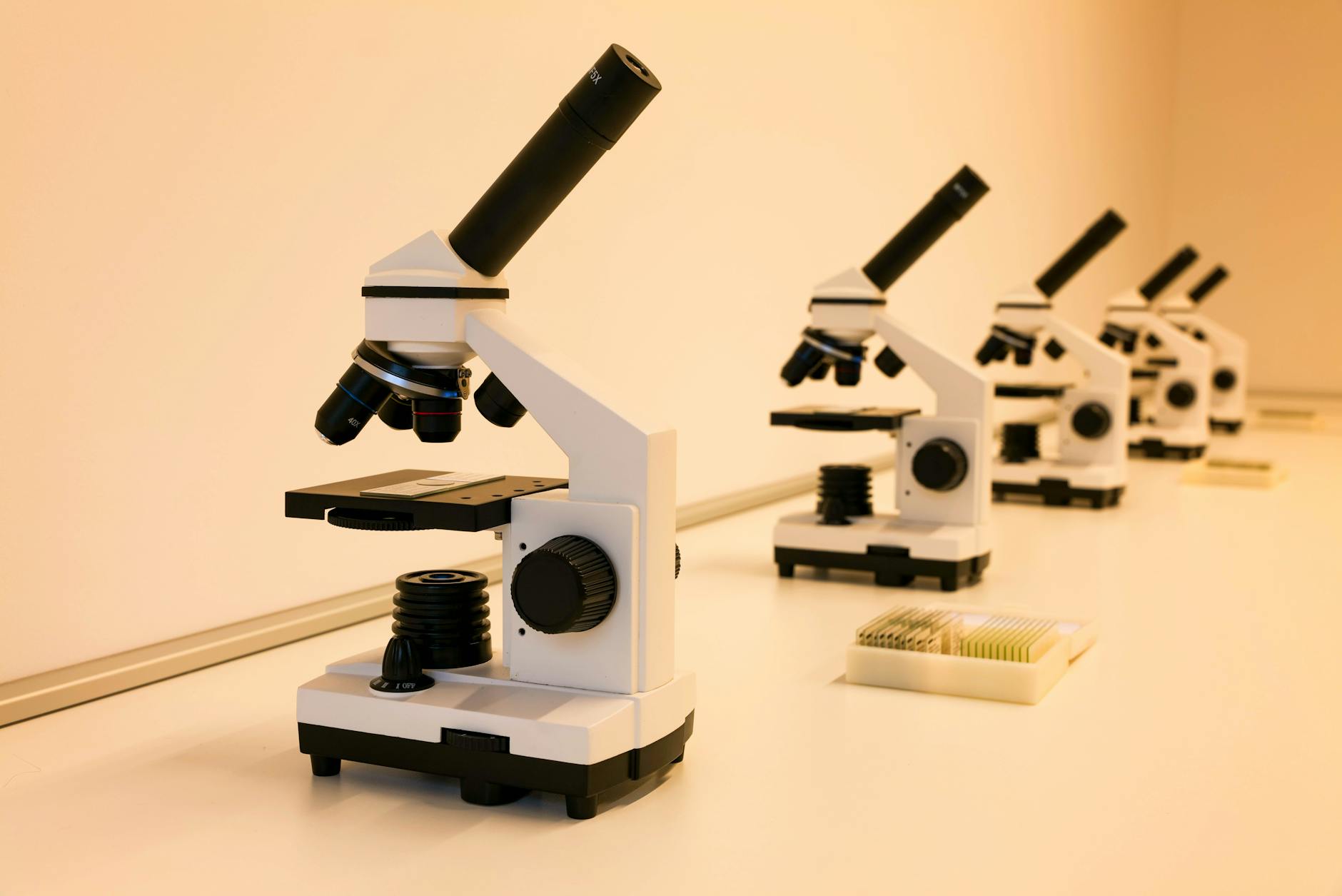 Modern scientific laboratory equipment and microscopes on research table