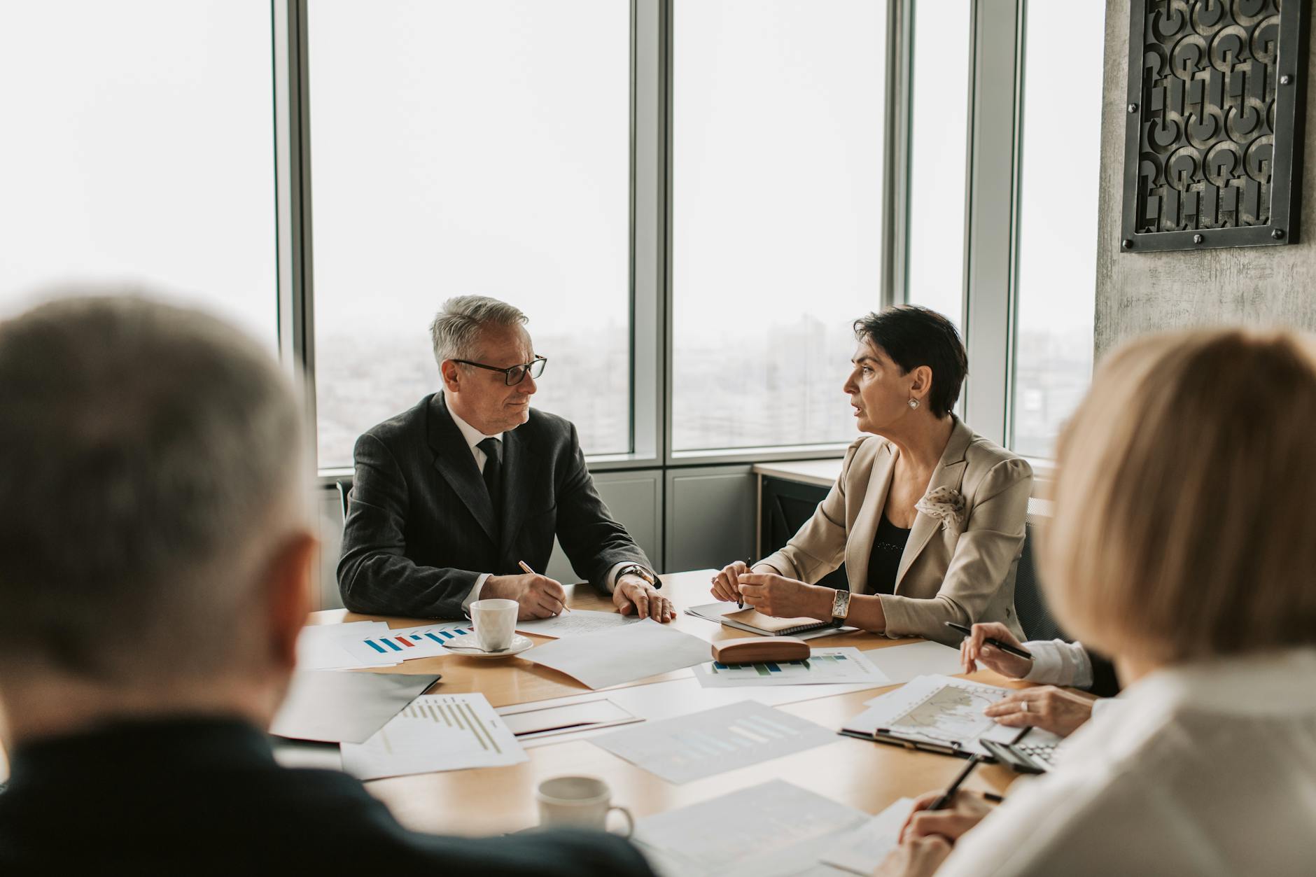 Technology professionals in a conference room discussing digital infrastructure and software development strategies