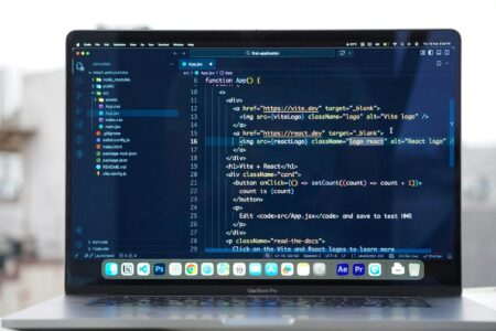 How WebAssembly Is Enabling Desktop-Quality Apps Inside Chrome Extensions Developer working on code with multiple browser windows open showing extension development interface