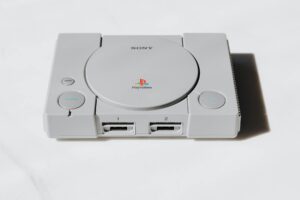 Nintendo’s Handheld Dominance Is Pushing Sony Back Into Portable Consoles Modern gaming console with controller on entertainment center