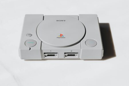 Nintendo’s Handheld Dominance Is Pushing Sony Back Into Portable Consoles Modern gaming console with controller on entertainment center