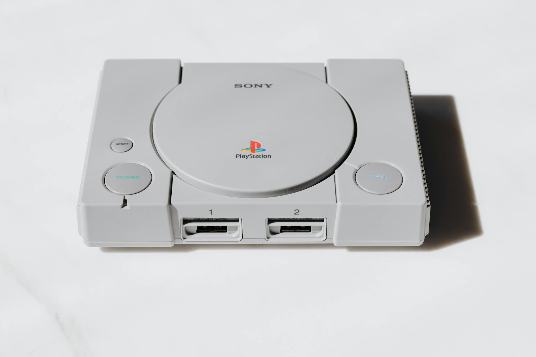 Modern gaming console with controller on entertainment center