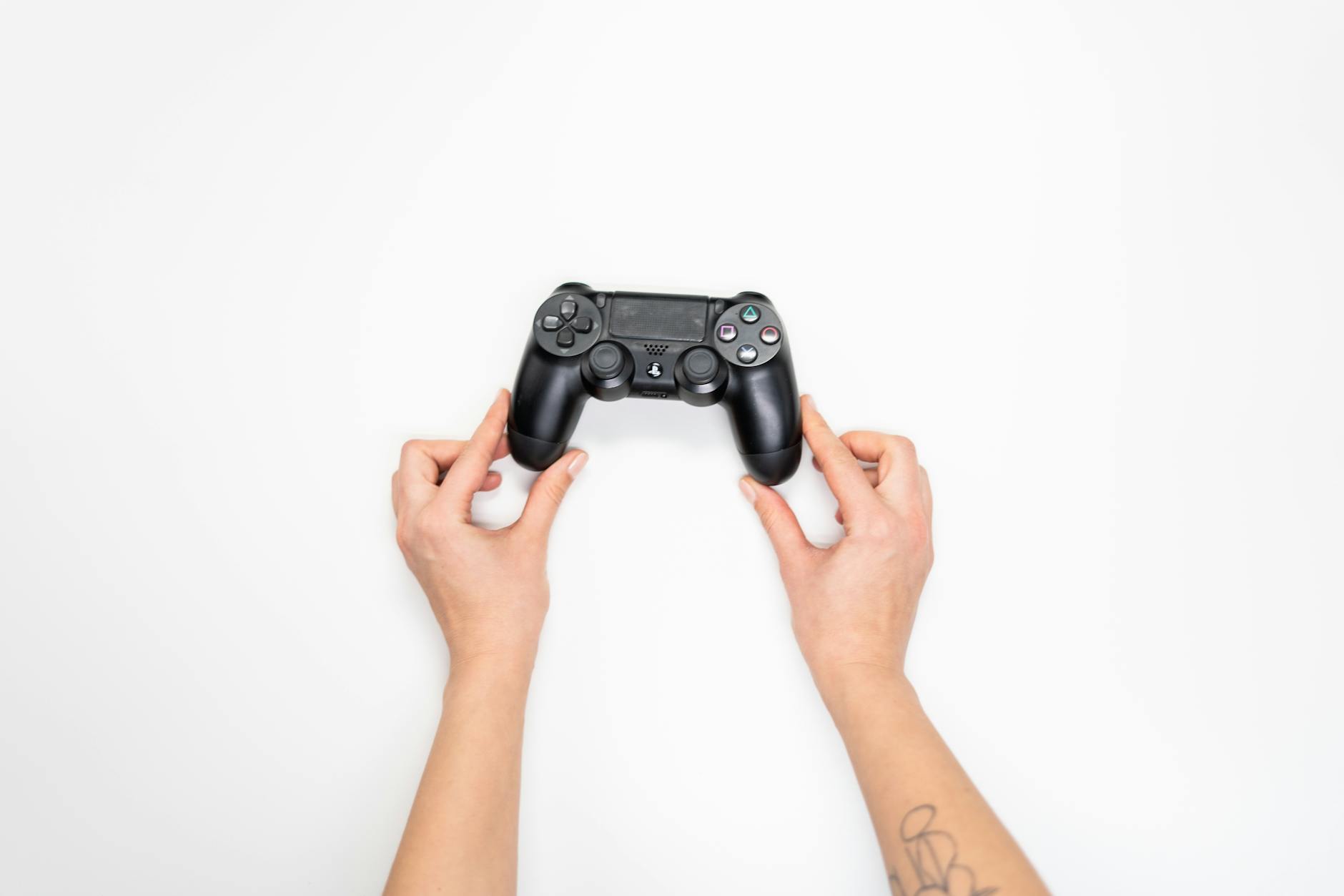 Person playing a portable gaming device in a casual setting