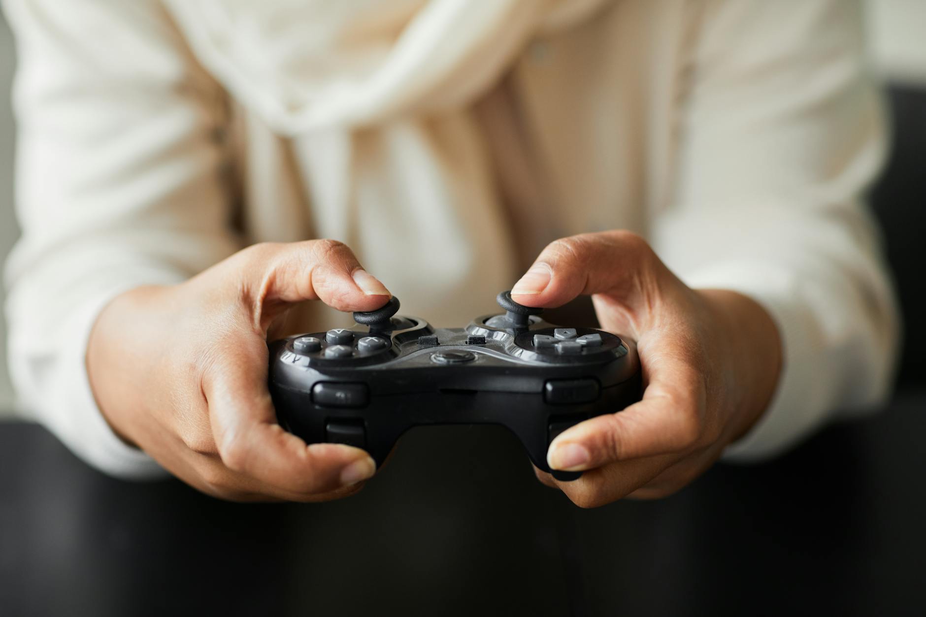 A player holding a gaming controller during an intense competitive match