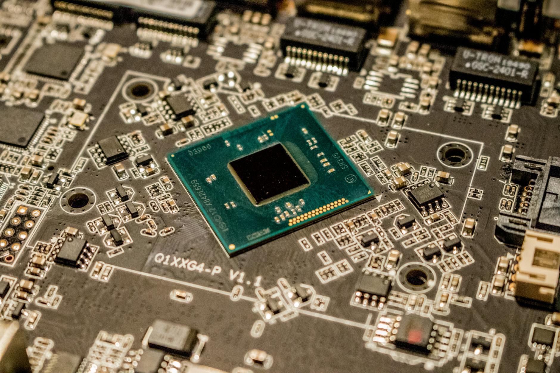 Macro shot of smartphone motherboard showing processor chip and electronic components