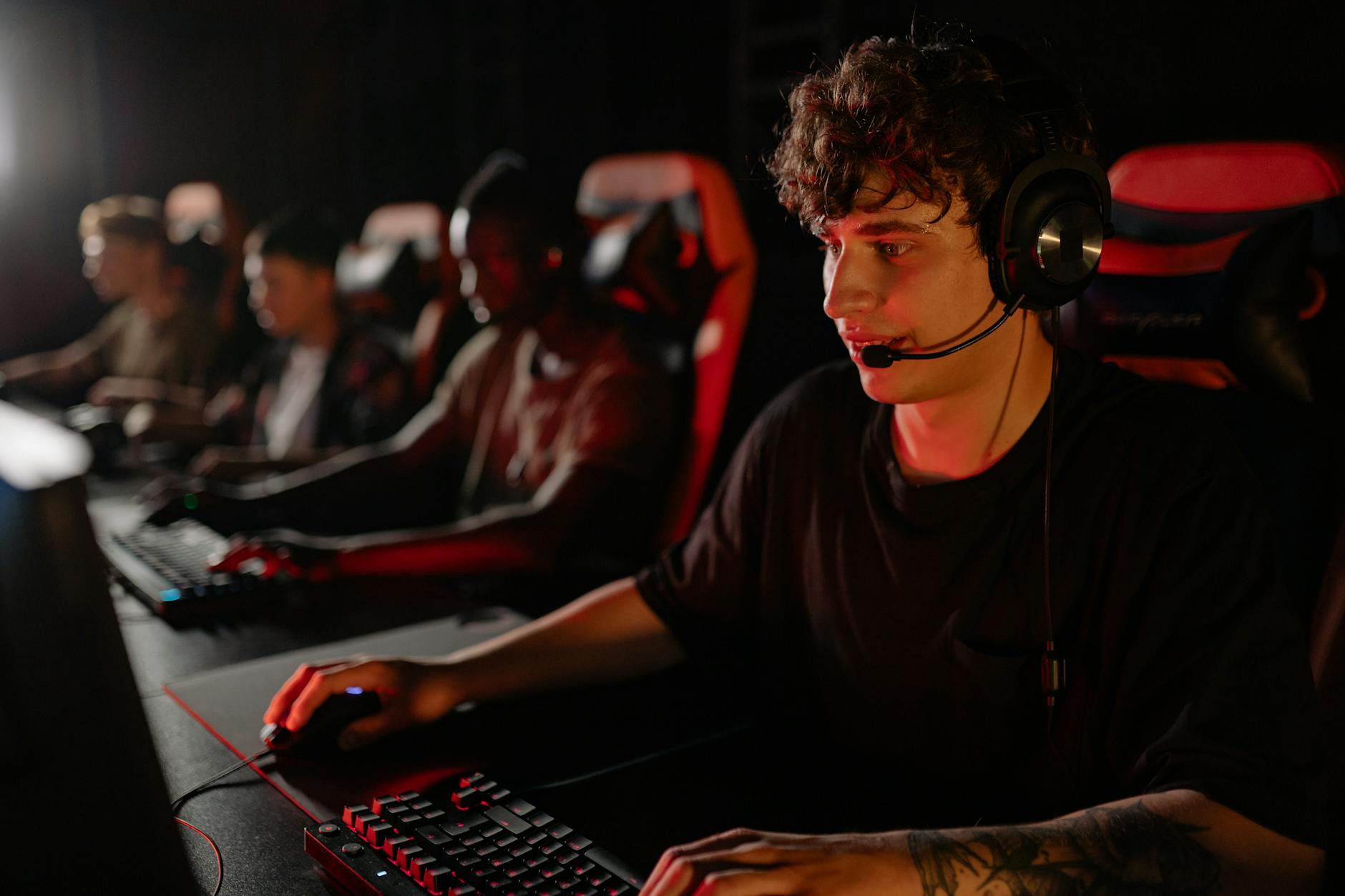 Players engaging with online gaming community content on desktop computers