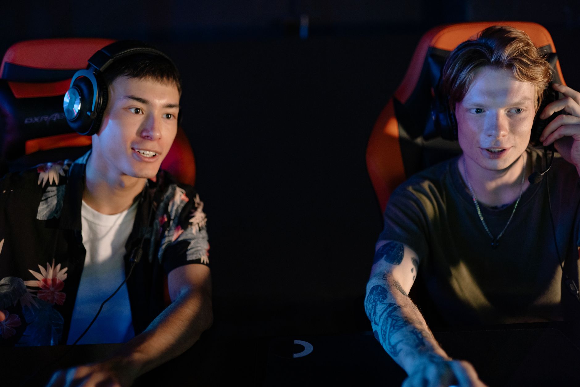 Players gathered around screens engaged in competitive online multiplayer gaming