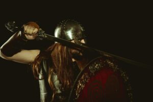Elden Ring Nightreign’s Co-Op Push Is Pulling Solo Players Online A lone warrior in dark armor standing in a shadowy fantasy landscape