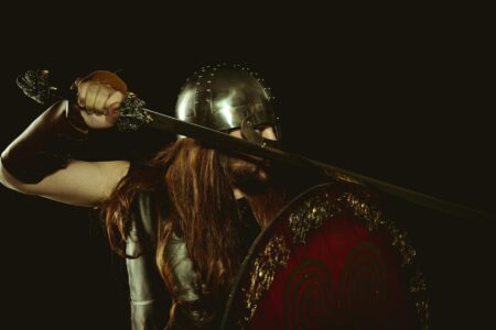 Elden Ring Nightreign’s Co-Op Push Is Pulling Solo Players Online A lone warrior in dark armor standing in a shadowy fantasy landscape