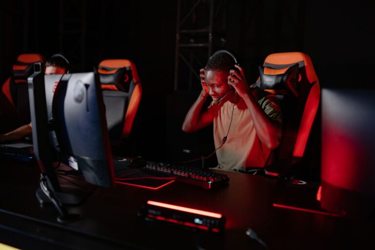 Ubisoft’s Rainbow Six Siege X Overhaul Is Splitting Its Veteran Base A gaming setup with multiple monitors showing a tactical shooter interface
