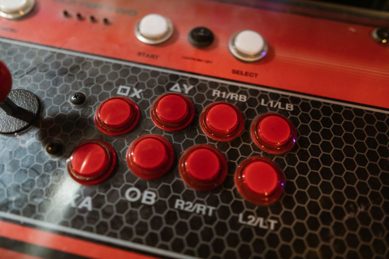 Capcom’s Marvel vs. Capcom Absence Is Sending Fans to Street Fighter 6 A fighting game arcade cabinet lit up in a dark gaming venue