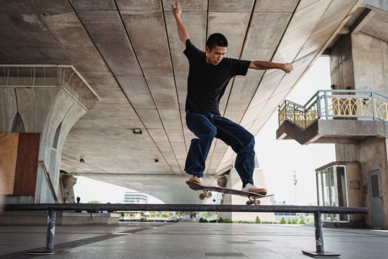 A skateboarder performing a trick on a city street