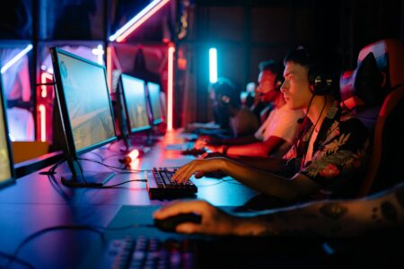 Competitive gamer focused on screen during ranked match