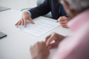 Legal documents and papers spread across a desk representing a gaming patent dispute