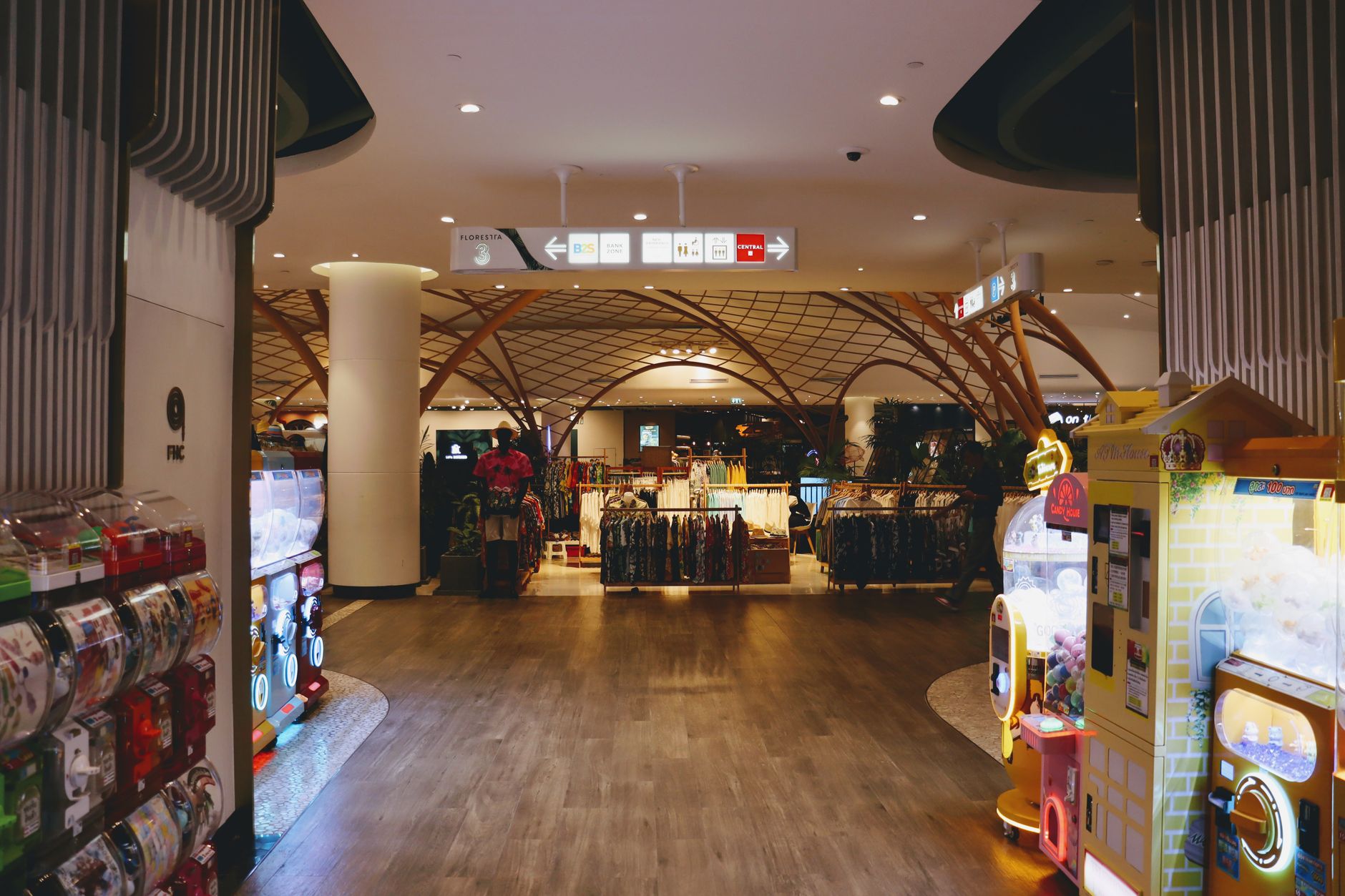 Inside a retail gaming store with console products on display