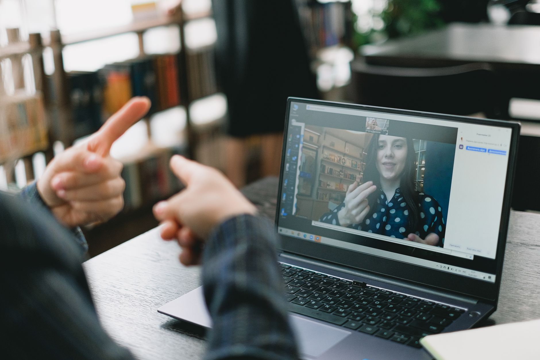Person reading a computer screen showing community discussion threads