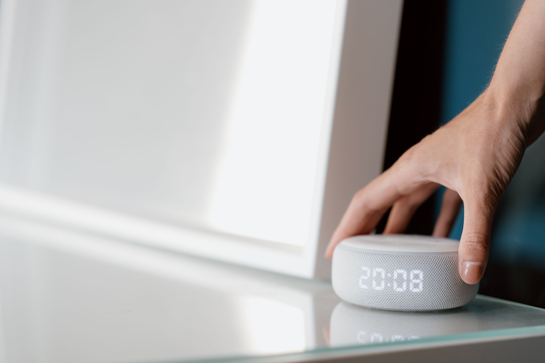 A small connected smart home device placed on a household surface