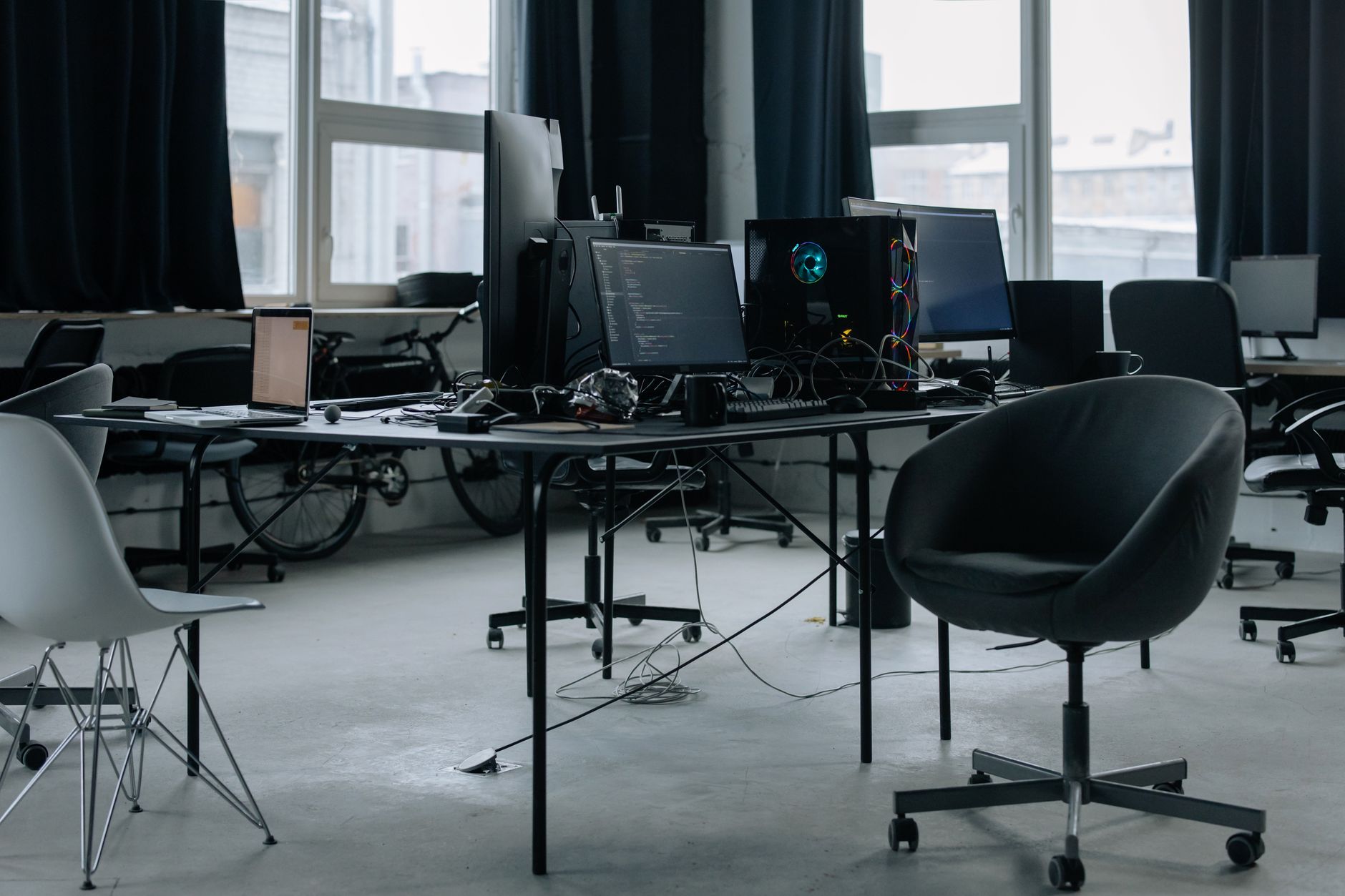 Developers working at computer screens in a game studio environment