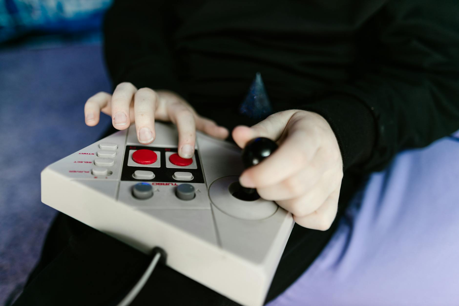 A classic video game controller resting on a surface, representing gaming nostalgia