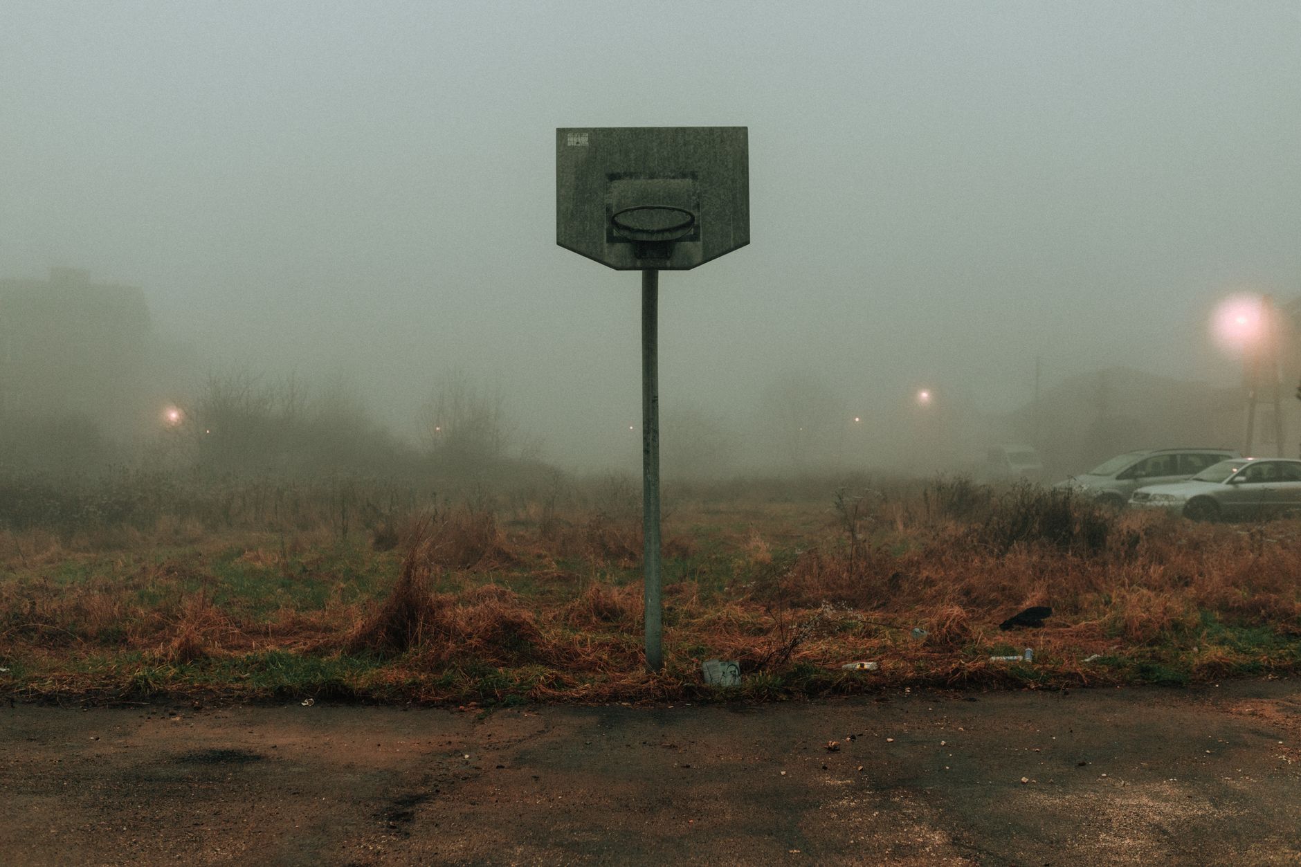 Foggy deserted street at night evoking psychological horror atmosphere