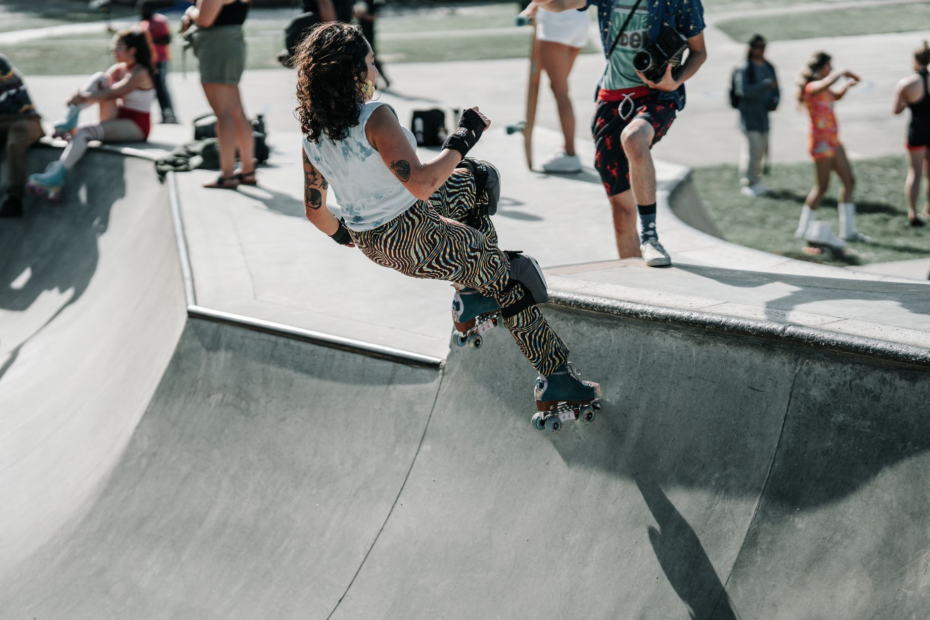An empty skate park with concrete ramps and rails