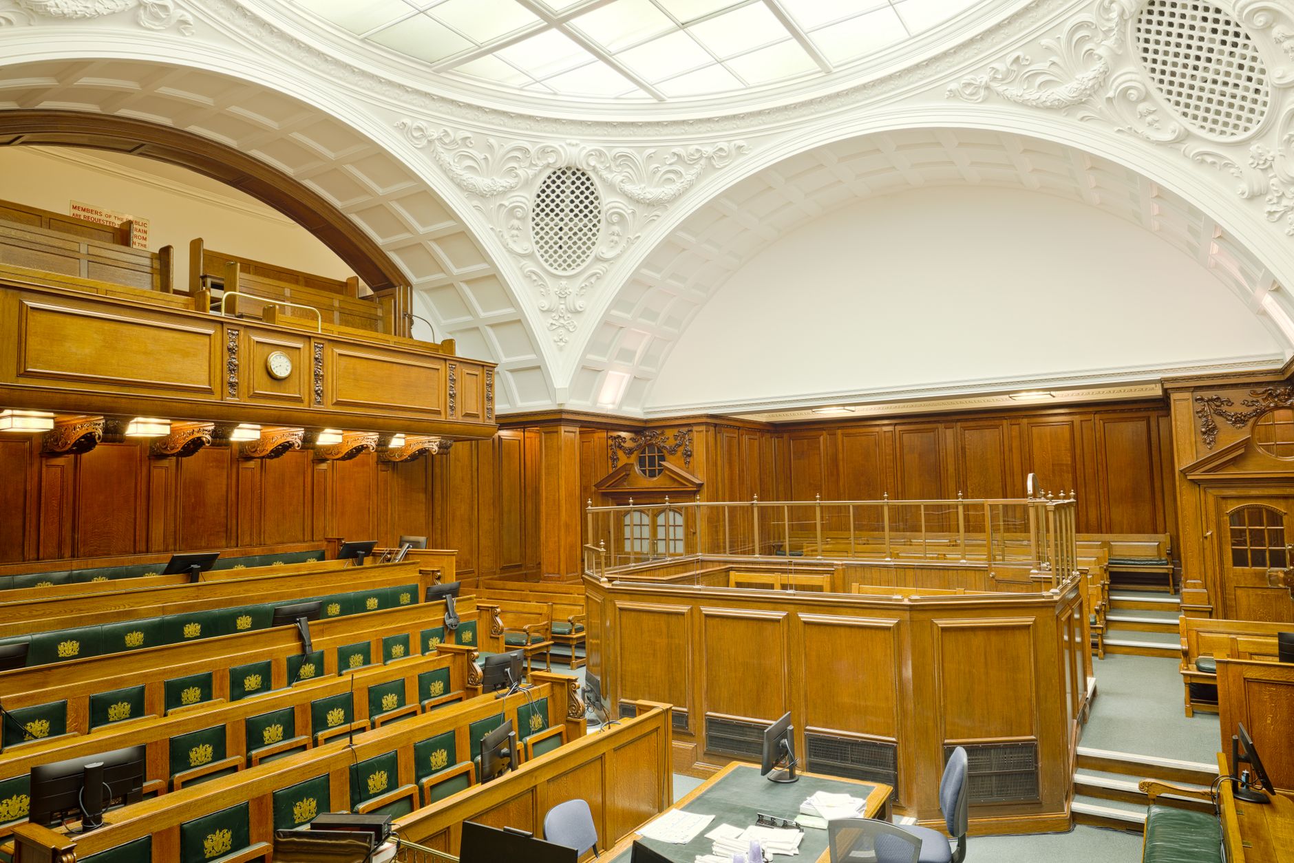 Empty courtroom interior representing legal proceedings in a patent case