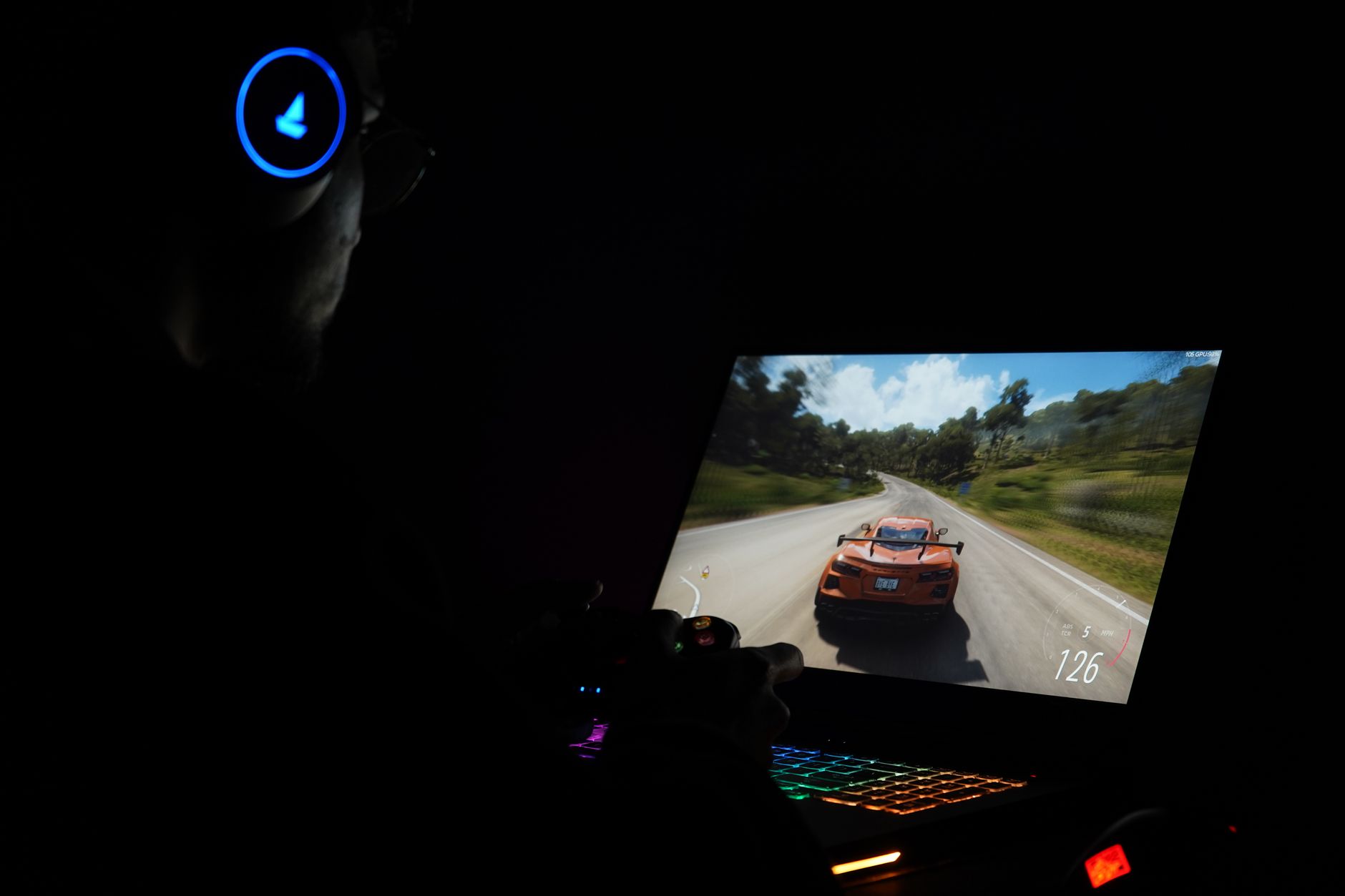 A dark gaming monitor glowing in a dim room, representing late-night gaming sessions