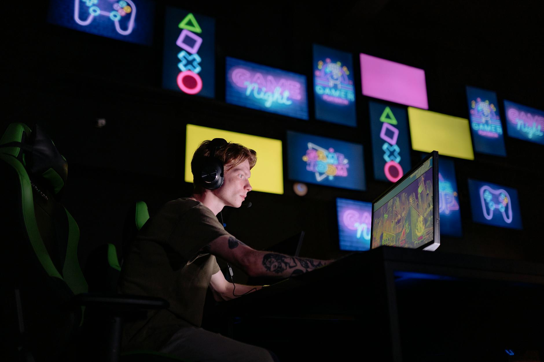 A player at a gaming setup with multiple screens, representing online competitive shooter gameplay
