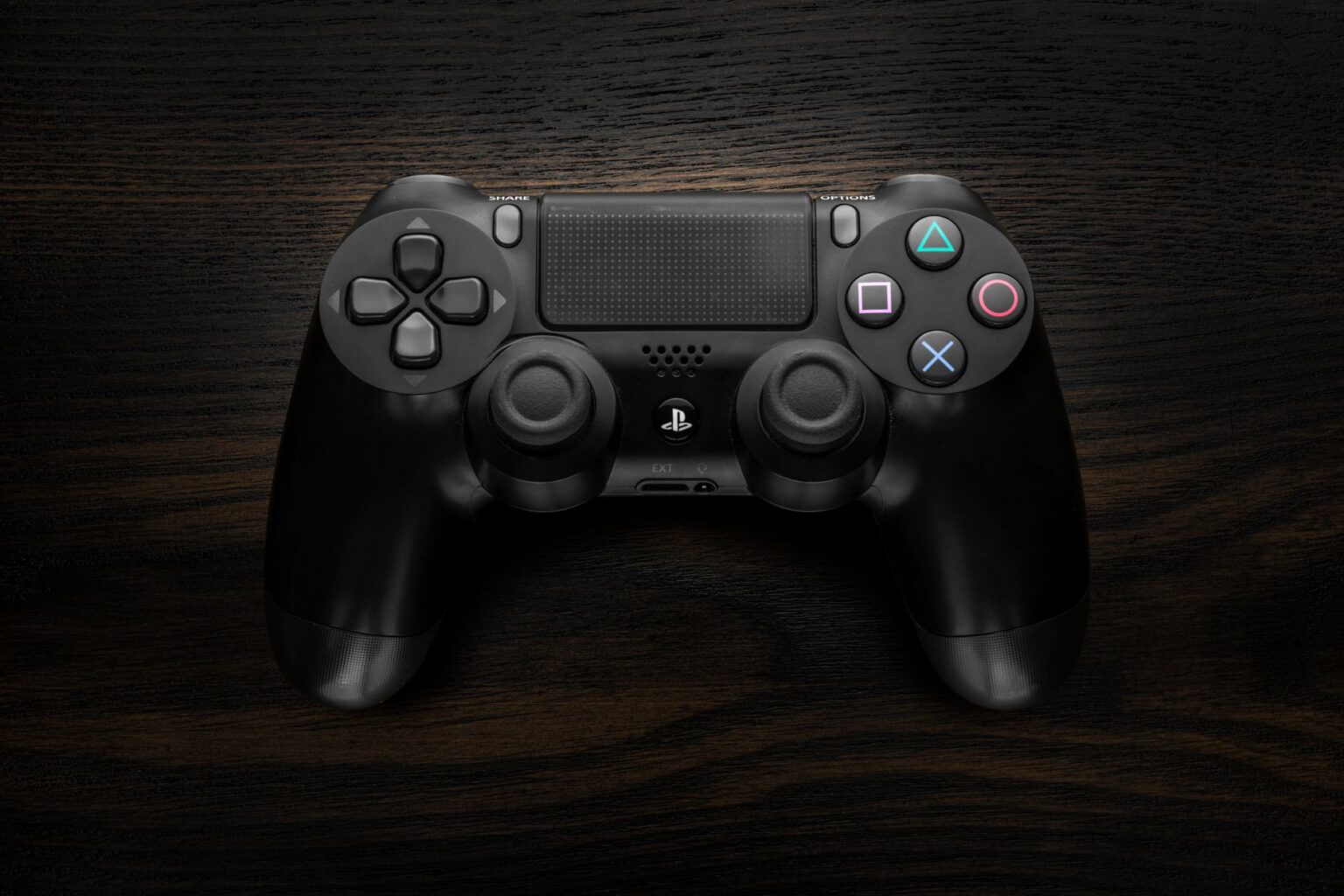 A game controller resting on a dark surface representing Xbox gaming culture