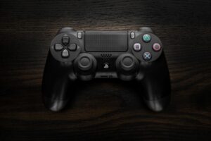 A game controller resting on a dark surface representing Xbox gaming culture