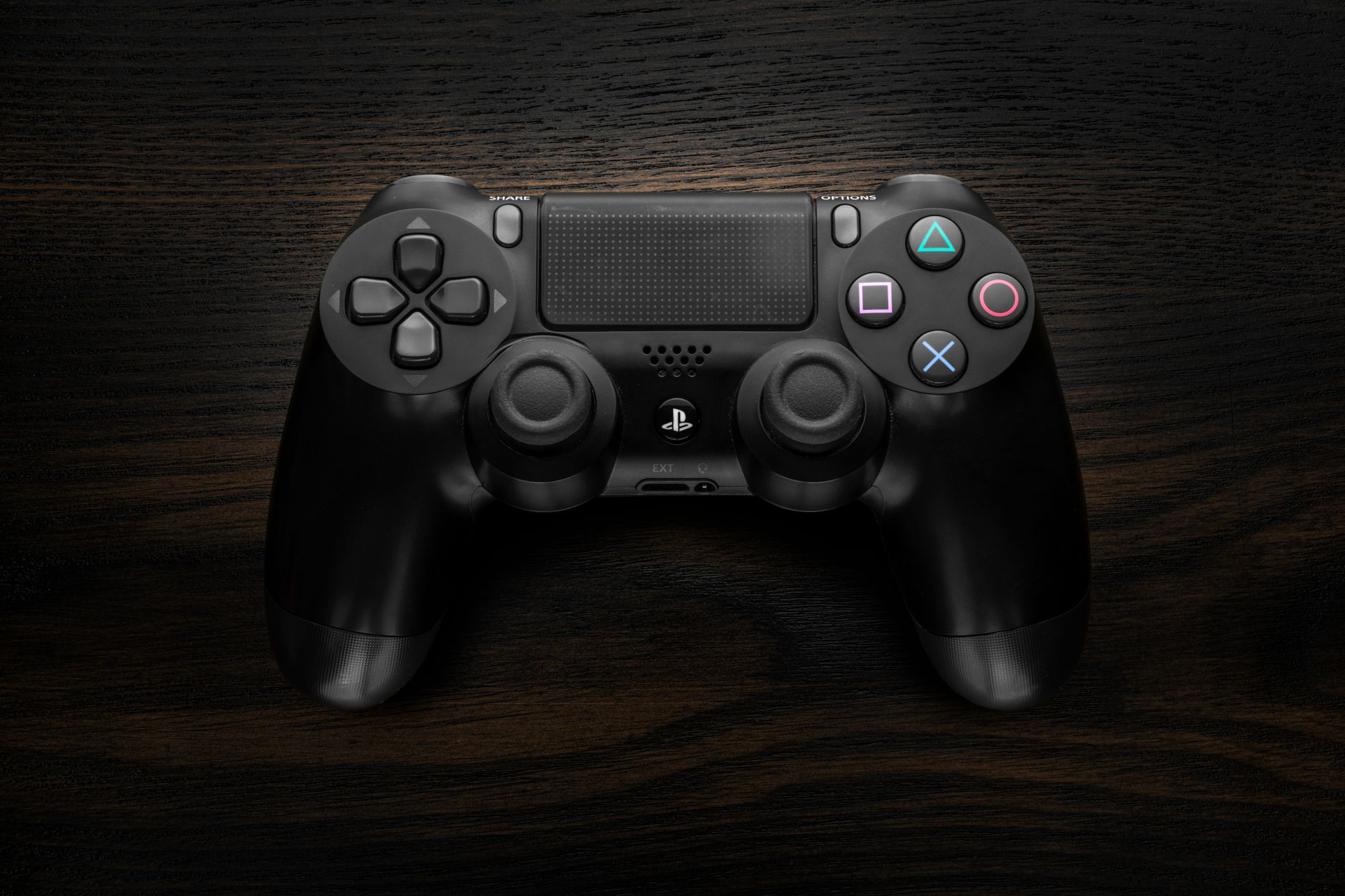 A game controller resting on a dark surface representing Xbox gaming culture