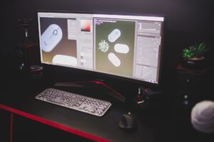 Valve’s Deadlock Silence Is Funneling Players Back to Dota 2 A dark gaming setup with a monitor displaying a colorful game interface