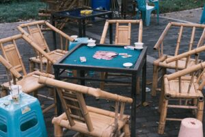 Physical trading cards spread across a game table representing strategic card gameplay