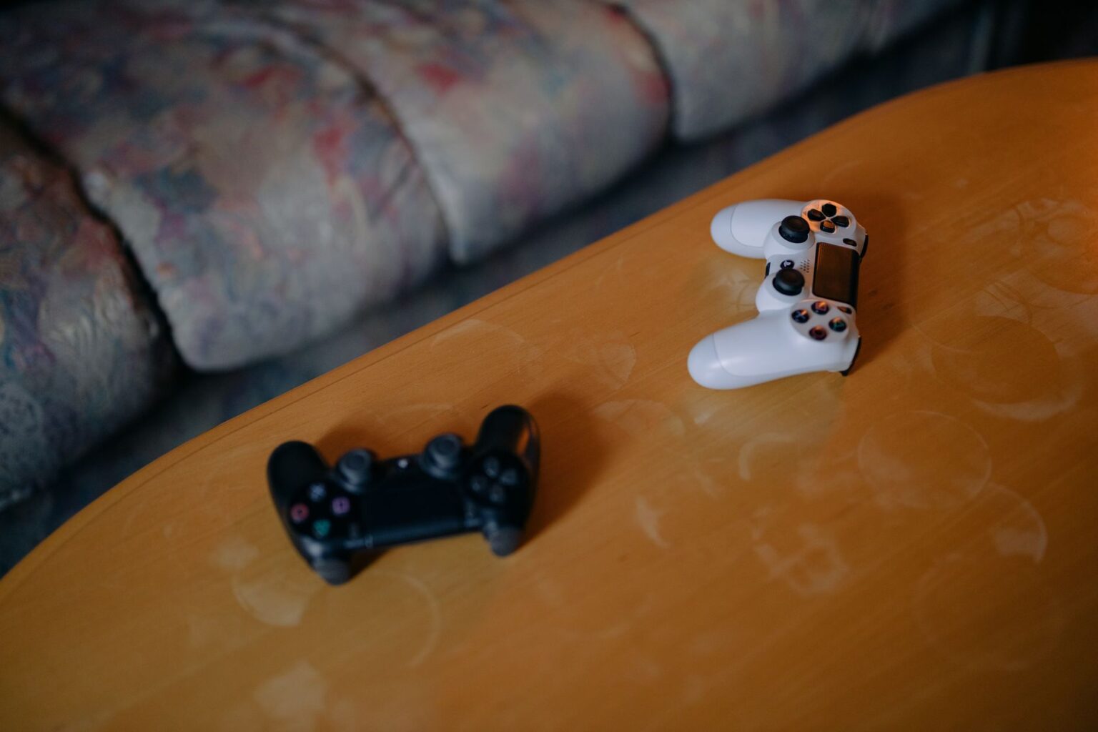 Helldivers 2’s Warbond Fatigue Is Quietly Reviving Deep Rock Galactic Person relaxing on a couch holding a game controller, representing casual gaming fatigue