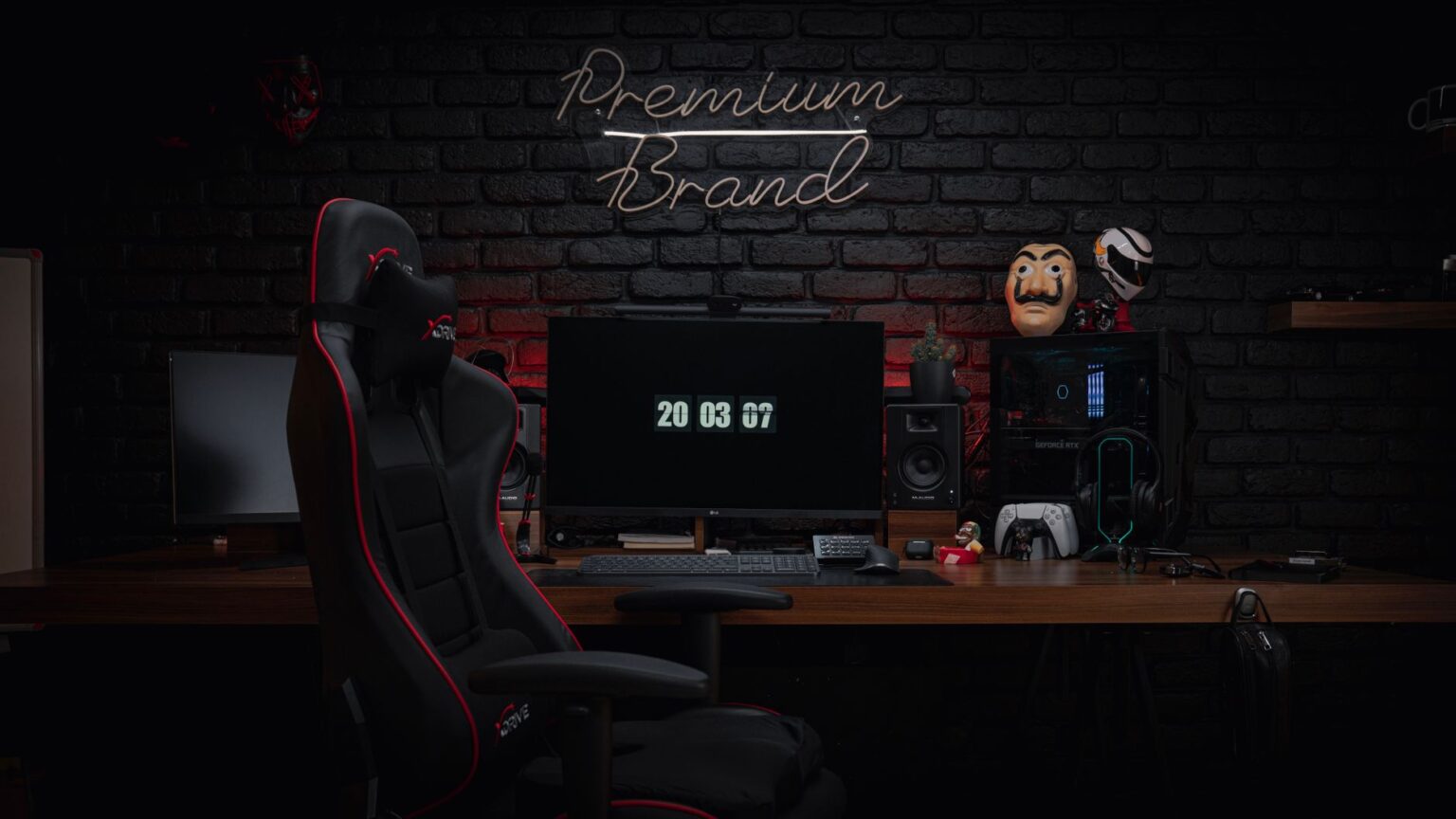 Dark gaming setup with monitor glowing in a dimly lit room