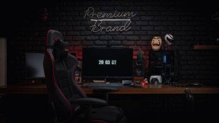 Ubisoft’s XDefiant Shutdown Is Quietly Sending Players Back to Siege Dark gaming setup with monitor glowing in a dimly lit room