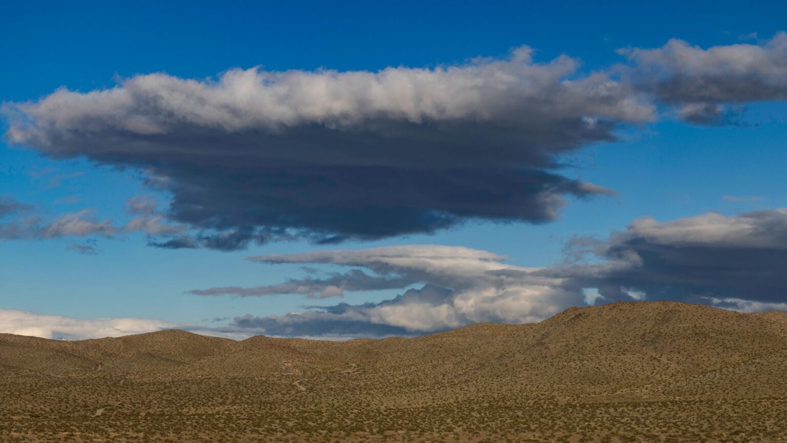 Wide open western desert landscape evoking the setting of Red Dead Redemption 2