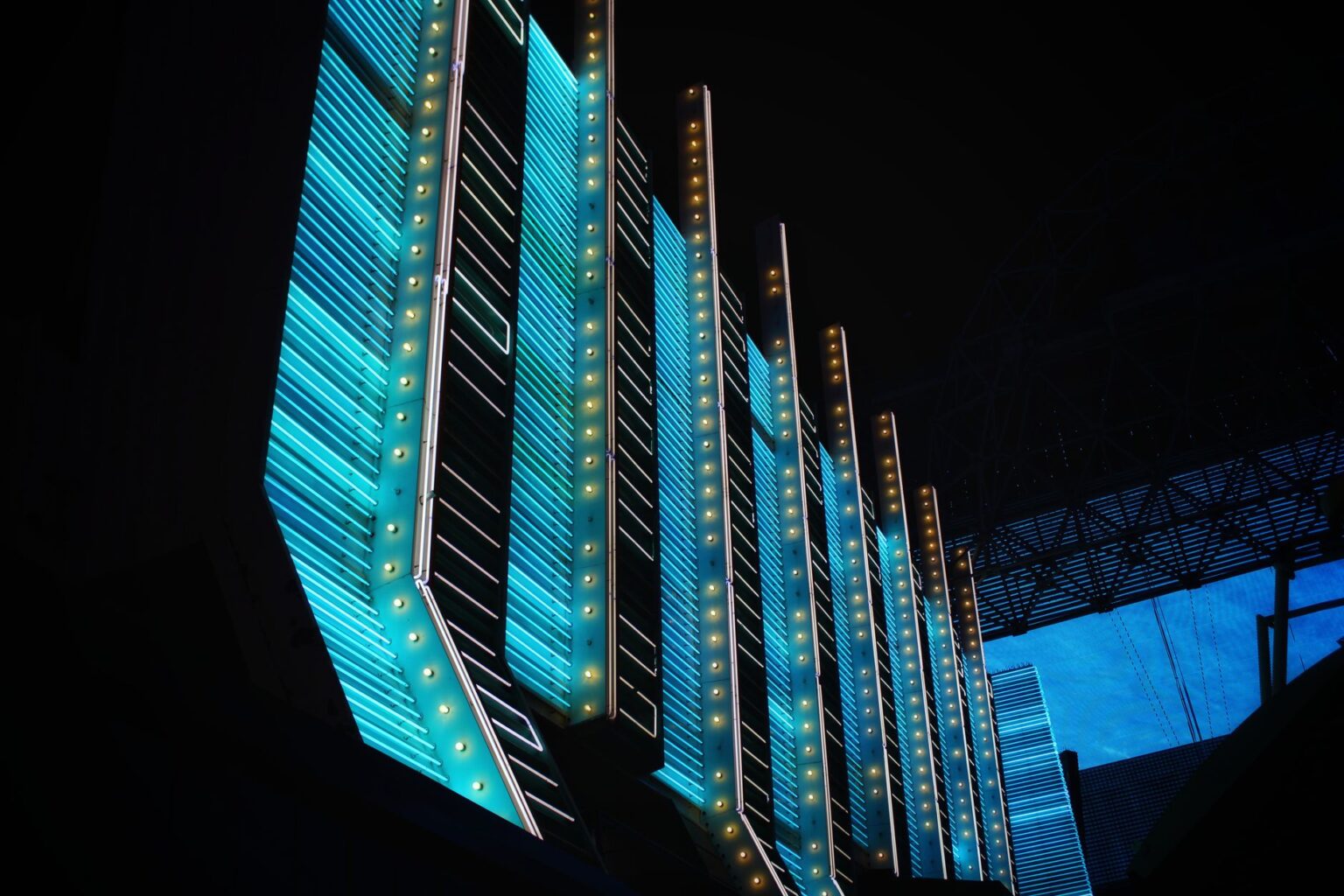 Neon-lit futuristic city street at night representing the cyberpunk aesthetic of Night City