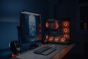Dark gaming setup with glowing monitor, representing immersive single-player gaming atmosphere
